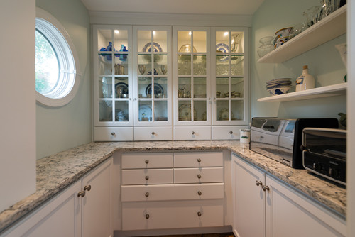 Cambria Praa Sands Perimeter Countertop with Soft Gray Cabinets and Sea Foam Color Wall Paint in Porthole Kitchen Window